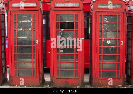 Traditional and icon red telephone boots or boxes seen in London. These kiosks were designed by Sir Giles Gilbert Scott. Stock Photo