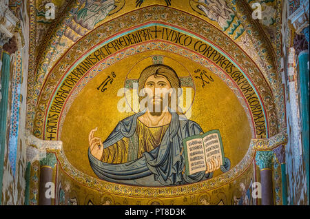 Golden mosaic with Christ Pantocrator in the apse of Cefalù Cathedral. Sicily, southern italy. Stock Photo