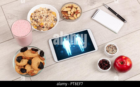 Arrangement of healthy Ingredients with a tablet. Dieting concept Stock Photo