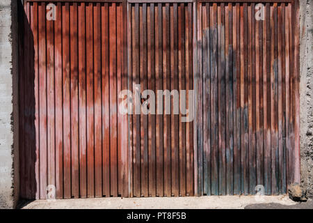 rusty metal gate, vintage iron door, house / garage Stock Photo