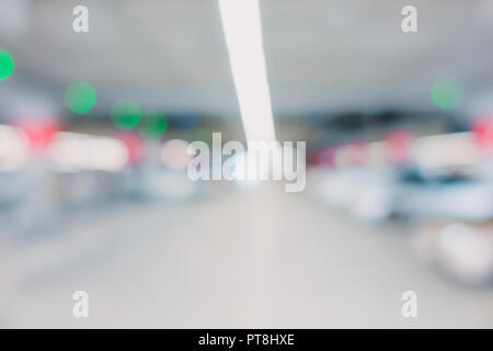 blur background of indoor car park in store with bokeh light Stock Photo