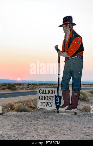 An old metal sign for the Calico Ghost Town with bullet holes in Yermo California Stock Photo