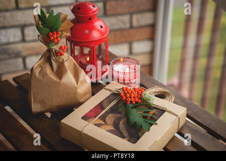 Set of cookies in gift boxes on dark wooden table Stock Photo