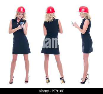 Young engineer woman in helmet checking processes on smartphone, isolated on white Stock Photo