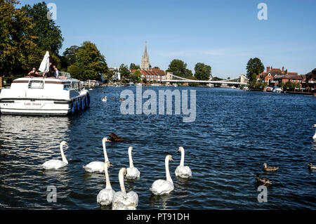 A summer scene at Marlow beside the river Thames in Buckinghamshire, Britain.  Both the suspension bridge and All Saints Church are the landmark of Ma Stock Photo