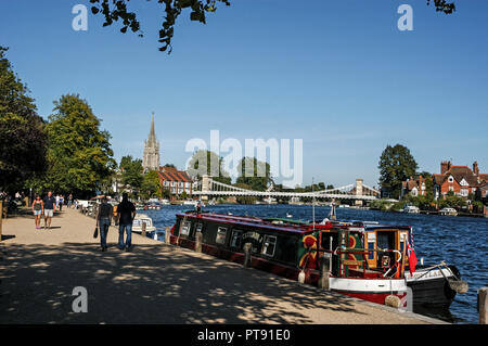 A summer scene at Marlow beside the river Thames in Buckinghamshire, Britain.  Both the suspension bridge and All Saints Church are the landmark of Ma Stock Photo