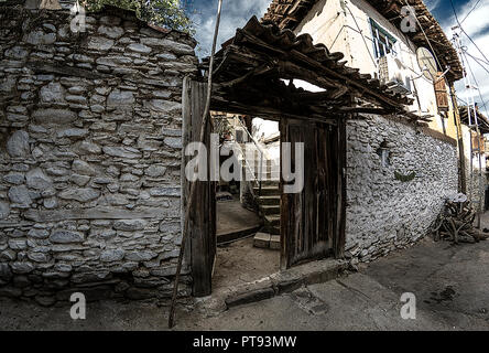 Birgi, hidden in a green geography on the cool slopes of Bozdağlar, can be seen from centuries-old plane trees and walnut trees with high stone walls, Stock Photo