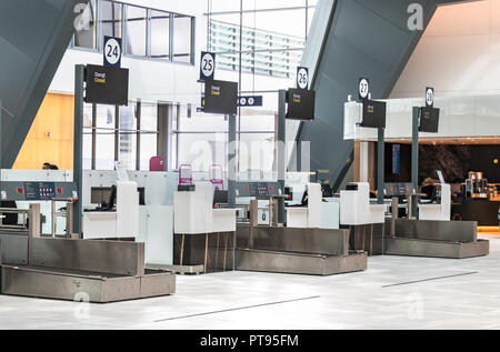 Automantic self-service bag checking machines inside the Bergen International Airport, Norway. Stock Photo