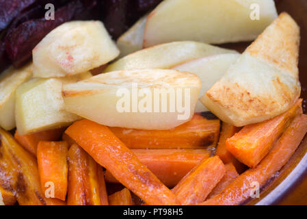 baked root vegetables on plate Stock Photo
