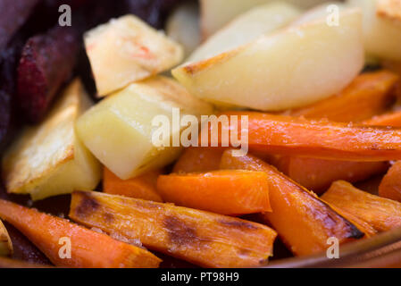 baked root vegetables on plate Stock Photo
