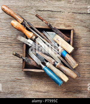 Old vintage hand tools on wooden background Stock Photo