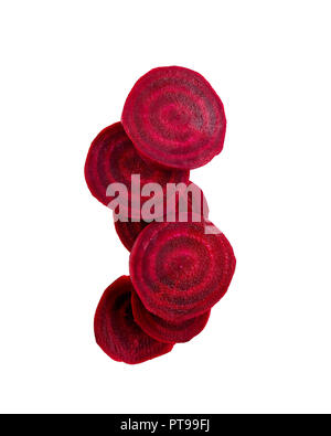 Slices of red beetroot against white background. Fresh young sliced beets. Stock Photo
