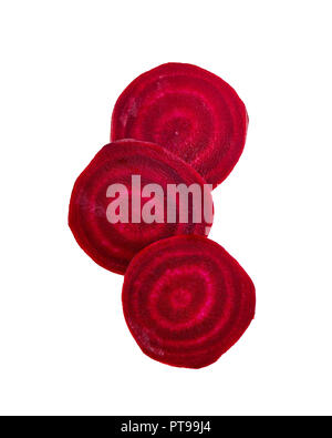 Slices of red beetroot against white background. Fresh young sliced beets. Stock Photo