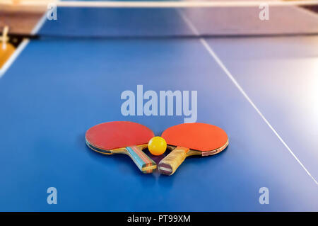 racket for tennis or ping pong on a blue table game. Table tennis Stock Photo