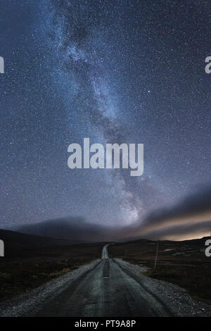The night sky with the milky way visible along with a shooting star and ...