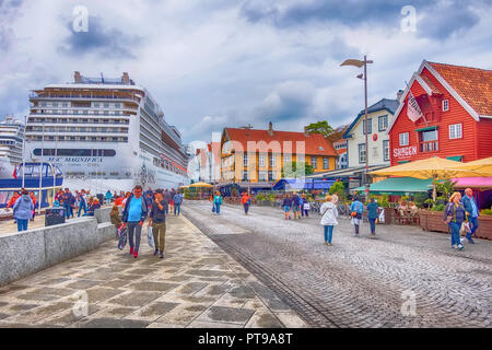 Stavanger, Norway - August 2, 2018: City street view with people, harbour and cruise ship MSC Magnifica Stock Photo