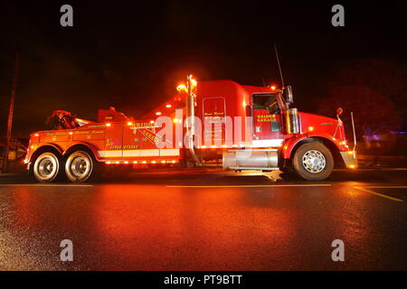 A Kenworth recovery truck arrives to the scene of an accident , where a ...