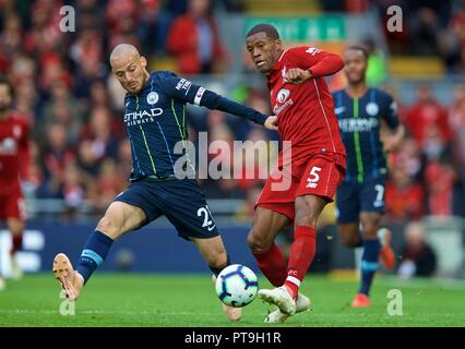 Liverpool. 8th Oct, 2018. Manchester City's David Silva (L) challenges Liverpool's Georginio Wijnaldum during the English Premier League match at Anfield in Liverpool, Britain on Oct. 7, 2018. The game ended in a 0-0 draw. Credit: Xinhua/Alamy Live News Stock Photo