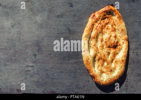 Traditional eastern bread on wooden background Stock Photo