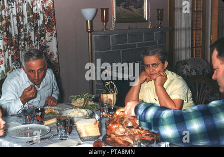 Three Generations of Family at Thanksgiving Meal. 1950's, USA Stock Photo