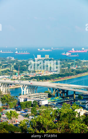 Singapore - August 18 2018: Aerial bird's eye view of Marina East Singapore featuring East Coast Expressway, Gardens by the Bay East, sea and ships Stock Photo