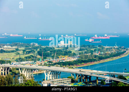 Singapore - August 18 2018: Aerial bird's eye view of Marina East Singapore featuring East Coast Expressway, Gardens by the Bay East, sea and ships Stock Photo