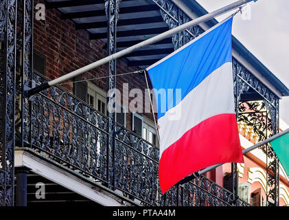 The French flag hangs from a balcony in the French Quarter, Nov. 15, 2015, in New Orleans, Louisiana. Stock Photo
