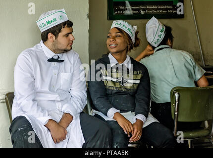 Employees take a break at Café Du Monde’s French Market location, Nov. 15, 2015, in New Orleans, Louisiana. Stock Photo