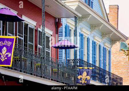 LSU and Who Dat Nation flags fly on the balcony in the French Quarter, November 11, 2015, in New Orleans, Louisiana. Stock Photo