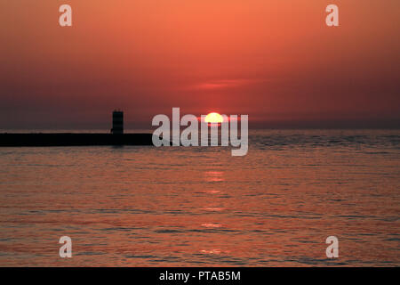 Ocean north pier of Douro river mouth at sunset, Porto, Portugal Stock Photo