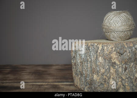 Wrought linseed rope used for various purposes placed on a stump Stock Photo