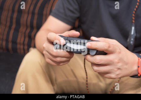 Young man playing video games Stock Photo