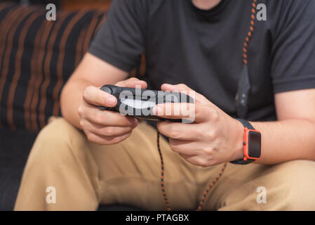 Young man playing video games Stock Photo