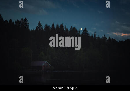 Dark moods after sunset. The night is coming on Jonsvatnet lake. NOrway, Trondheim area. Stock Photo