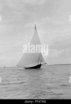 The yawl 'Harbinger' running downwind, 1922. Creator: Kirk & Sons of Cowes. Stock Photo