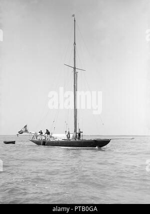 The sailing yacht 'Rollo' at anchor, 1911. Creator: Kirk & Sons of Cowes. Stock Photo