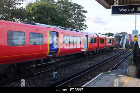 South Western Railways train passing through  Barnes Bridge railway station Mortlake London UK Photograph taken by Simon Dack Stock Photo