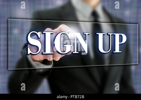 Sign Up in text on a virtual screen in a computer navigation bar with a businessman activating the button with his finger from behind as he opens an a Stock Photo