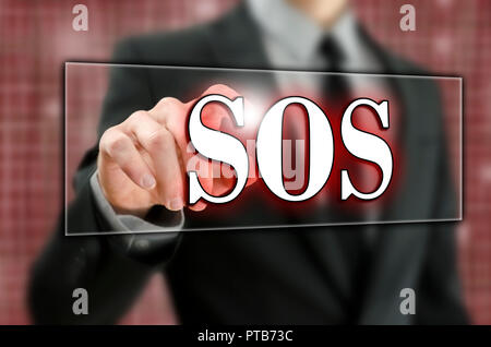 Businessman pressing SOS button on virtual screen. Stock Photo