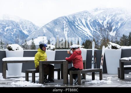 Senior couple interacting while having coffee Stock Photo