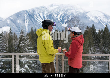 Senior couple interacting while having coffee Stock Photo