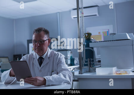 Male scientist using digital tablet Stock Photo