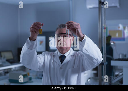 Male scientist experimenting in laboratory Stock Photo