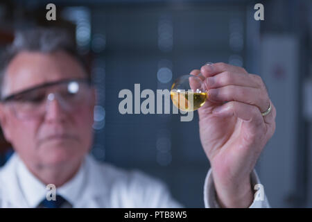 Male scientist experimenting in laboratory Stock Photo