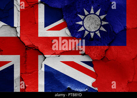 flags of UK and Taiwan painted on cracked wall Stock Photo