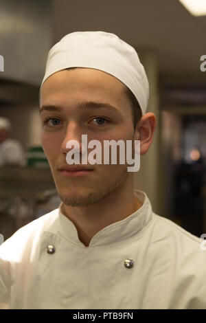 Male chef standing in kitchen at restaurant