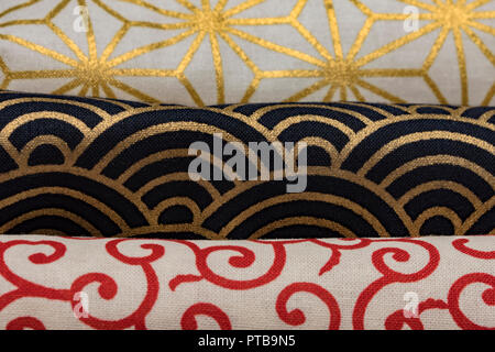 Highly detailed all over background texture of traditionals japaneses red, gold and white and black hemp leaves or rainbow  shaped pattern design text Stock Photo