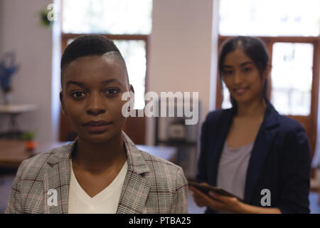 Business colleagues standing in office Stock Photo