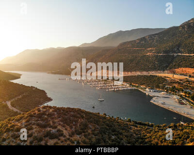 Aerial Drone View of Kas Marina Dock Pier with Small Boats and Yachts in Antalya Turkey. Vacation in Turkey Stock Photo