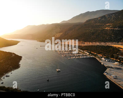 Aerial Drone View of Kas Marina Dock Pier with Small Boats and Yachts in Antalya Turkey. Vacation in Turkey Stock Photo